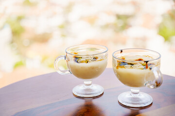 Traditional Turkish pudding. Sweetness for breakfast on the background of the seaside city. Delicious treat from Turkey. A postcard from Turkey