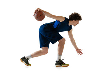 Young muscular basketball player in action, motion isolated on white background. Concept of sport,...