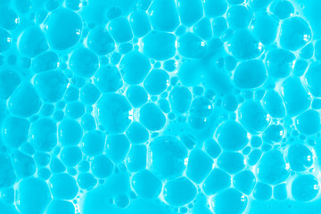 Bubble light blue background texture. Berry gel to cleanse the skin of the face and body. Spa treatments, skin care. Bath foam, detergent. Slime blue