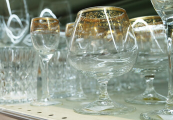 Row of different glass goblets. Barware, close-up