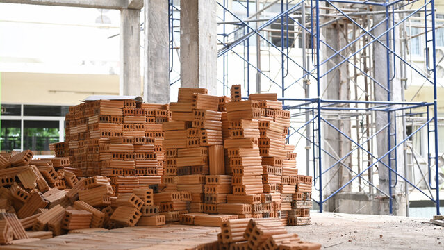 Pile of new bricks at the construction site. Concept of repair and building materials