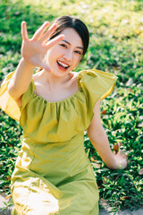 Portrait of beautiful young Asian woman with sunshine