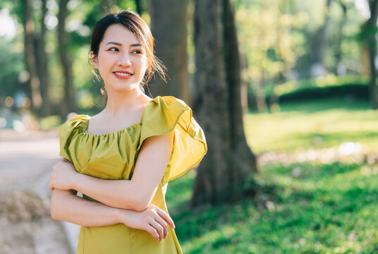 Portrait of beautiful young Asian woman with sunshine