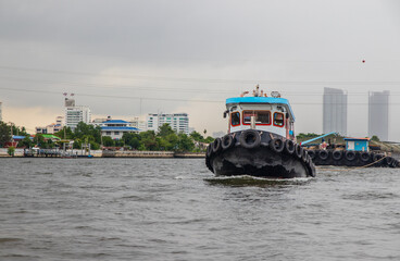 A Tugboat at the Chao Phraya River in Bangkok Thailand Asia