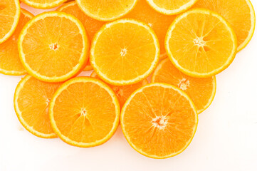 Abstract background with citrus-fruit of orange slices. Close-up of orange slices on white background.