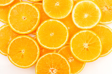 Abstract background with citrus-fruit of orange slices. Close-up of orange slices on white background.
