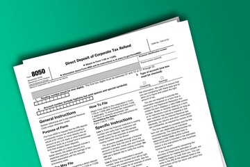 Fototapeta premium Form 8050 documentation published IRS USA 42563. American tax document on colored
