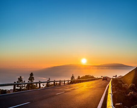  View of sunset over Island La Gomera from Teide National Park road. Tenerife Island.