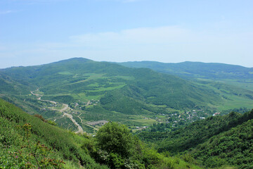 Fototapeta na wymiar Small village in the green mountains.