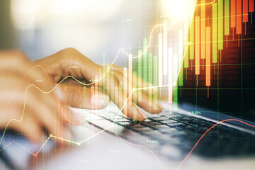 Multi exposure of abstract financial diagram with hand typing on computer keyboard on background, banking and accounting concept