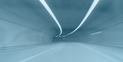 Abstract speed motion in blue highway road tunnel