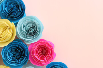 Fototapeta na wymiar Top view image of colorful paper flowers composition over pastel pink background