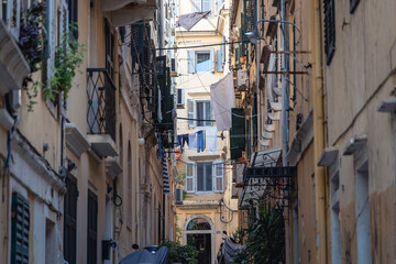 Fototapeta na wymiar Narrow alley with residential building in historic part of Corfu city, capital of Corfu Island, Greece