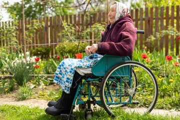 Obraz premium very old senior woman in wheelchair