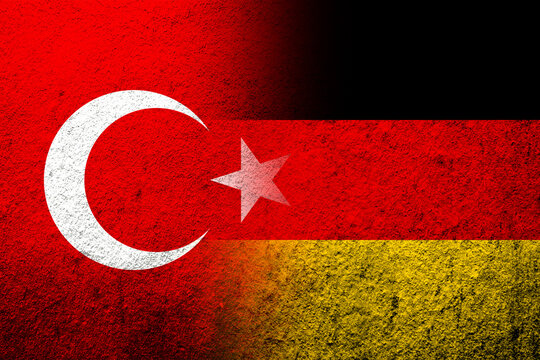 The national flag of Germany with National flag of Turkey. Grunge background