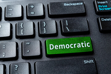 Democratic green key on a black desktop keyboard. Concept of voting online for Democratic party,...