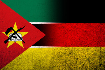 The national flag of Germany with The Republic of Mozambique National flag. Grunge background