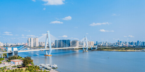 High view sunny day scenery of Century Bridge on Haidian River, Haikou, Hainan, China