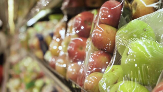 Apples in plastic wrap.