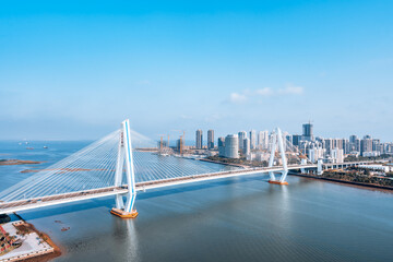High view sunny day scenery of Century Bridge on Haidian River, Haikou, Hainan, China