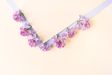 Beautiful flower arrangement. Lilac flowers, free space for text on a light pastel background. Wedding, birthday. Valentine's day, mother's day. Top view, copy space