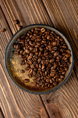 coffee beans on the plate and wooden table