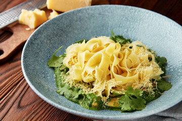 Fettuccine pasta with pesto sauce.