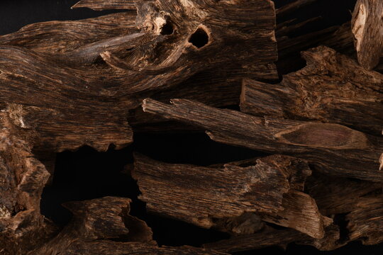 Close UpShot Of Sticks Of oudh On Black Background The Incense Chips Used By Burning It Or For Arabian Oud Oils Or Bakhoor
