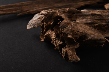 Close UpShot Of Sticks Of oudh On Black Background The Incense Chips Used By Burning It Or For Arabian Oud Oils Or Bakhoor
