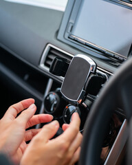 Obraz na płótnie Canvas Phone holder in the car with handles..