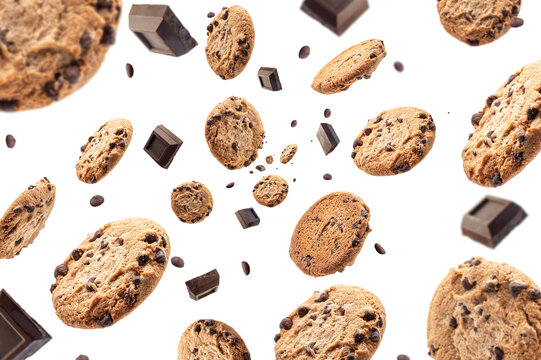 Collection of half chocolate chip cookies and pieces of delicious dark chocolate on white background