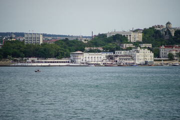 Fototapeta na wymiar The city of Sevastopol from the sea with a variety of buildings and ships
