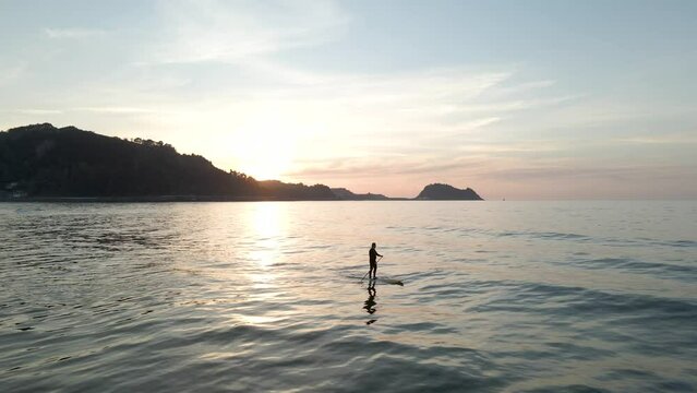 sunset on the sea paddle surf