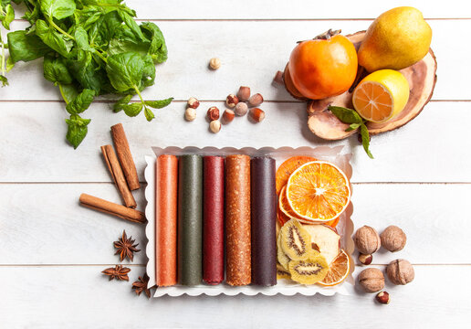 Fruit pastille of different flavors and fruit chips or dried fruit slices in a gift box