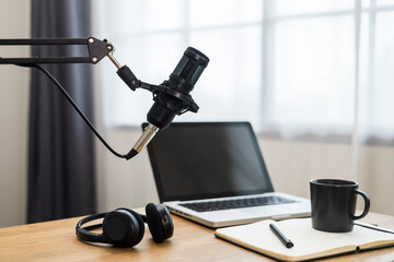 Condenser microphone in recording home studio. Content creator working with laptop host streaming radio podcast interview conversation at home broadcast studio recording voice over radio - obrazy, fototapety, plakaty