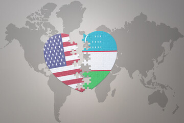 puzzle heart with the national flag of united states of america and uzbekistan on a world map background. Concept.