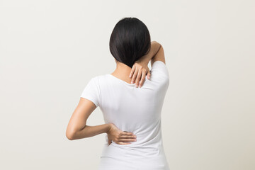 Asian woman has problem with structural posture She had neck and back pain. She massaged her neck and shoulders for relief. reduce muscle tension. Standing on isolated white background - Powered by Adobe