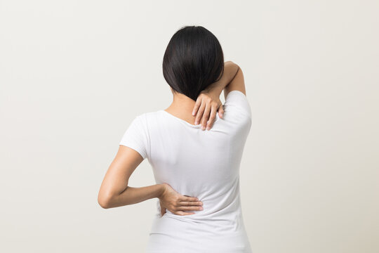 Asian Woman Has Problem With Structural Posture She Had Neck And Back Pain. She Massaged Her Neck And Shoulders For Relief. Reduce Muscle Tension. Standing On Isolated White Background