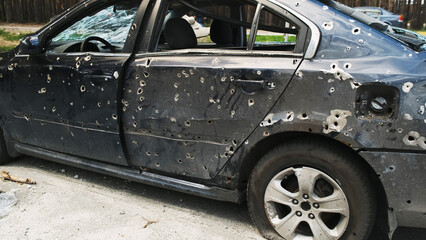 Shot car in Irpin, the consequences of the invasion of Russian troops in Ukraine