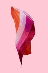 lesbian pride flag waving on a pink background