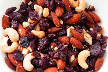 almonds, cashews and dried berries together. energy nutrition concept. mixed dried fruits and nuts