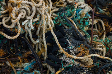 Close -up on Discarded Nylon and rope Fishing Net Washed Up on the Shore, west coast of Ireland. - obrazy, fototapety, plakaty