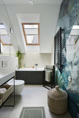 Stylish bathroom design with panels painted in green on the wall. Bathtub, towels, rattan baskets...