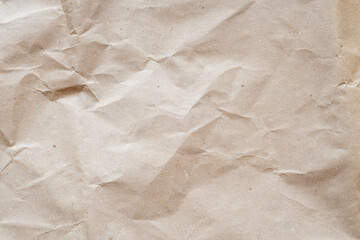 Background with texture of crumpled recycled cardboard paper. Substrate on the topic of recycling materials.