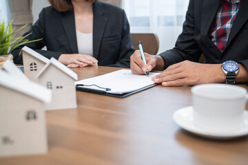 Agreement deal with man signature on contract buying insurance or taking bank loan.