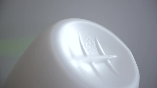 4k Closeup view of 2 HDPE recycle sign or label on white plastic package spbd. Polyethylene is versatile plastic with many uses, especially when it comes to packaging. It carries low risk of leaching