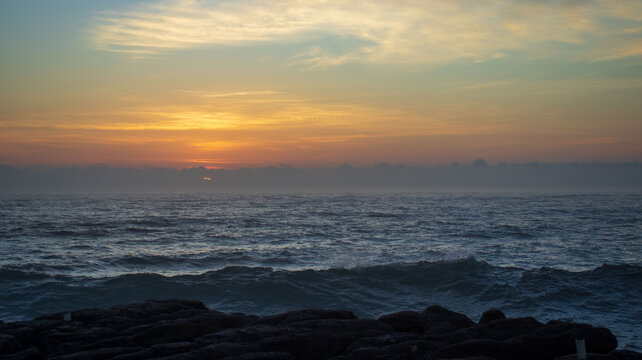 A early morning sunrise seen over the ocean on the south coast of South Africa