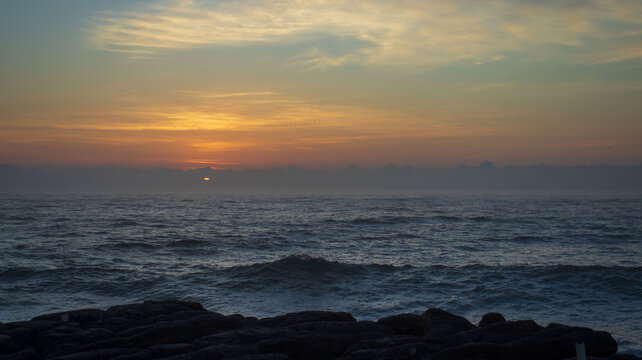 A early morning sunrise seen over the ocean on the south coast of South Africa