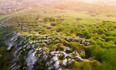 Aerial panoramic view of a scenic geological karst and limestone plateau with sinkholes and caves - obrazy, fototapety, plakaty