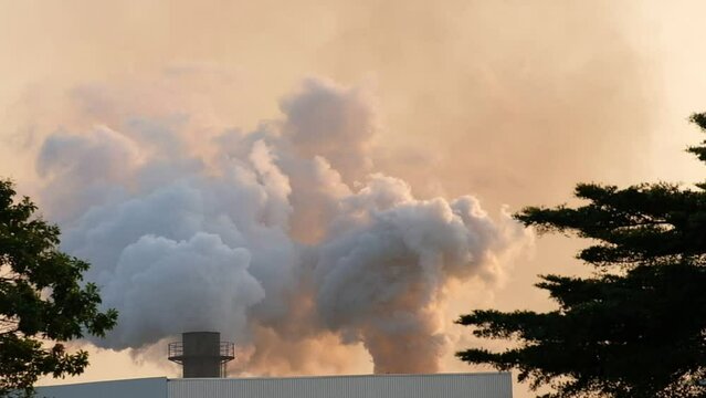 Industrial factory is burning with pollution smoke from chimney